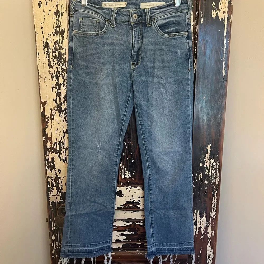 Women’s Pilcro and The Letterpress distressed High Rise Flare raw hem Jeans.